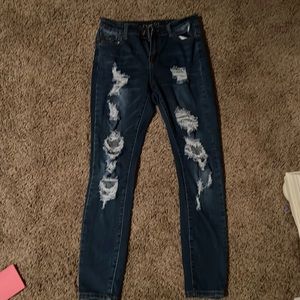 Woman’s jeans distressed high rise size 8